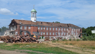 Pastore building with a wall torn down