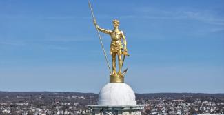 independent man statue on top of the statehouse